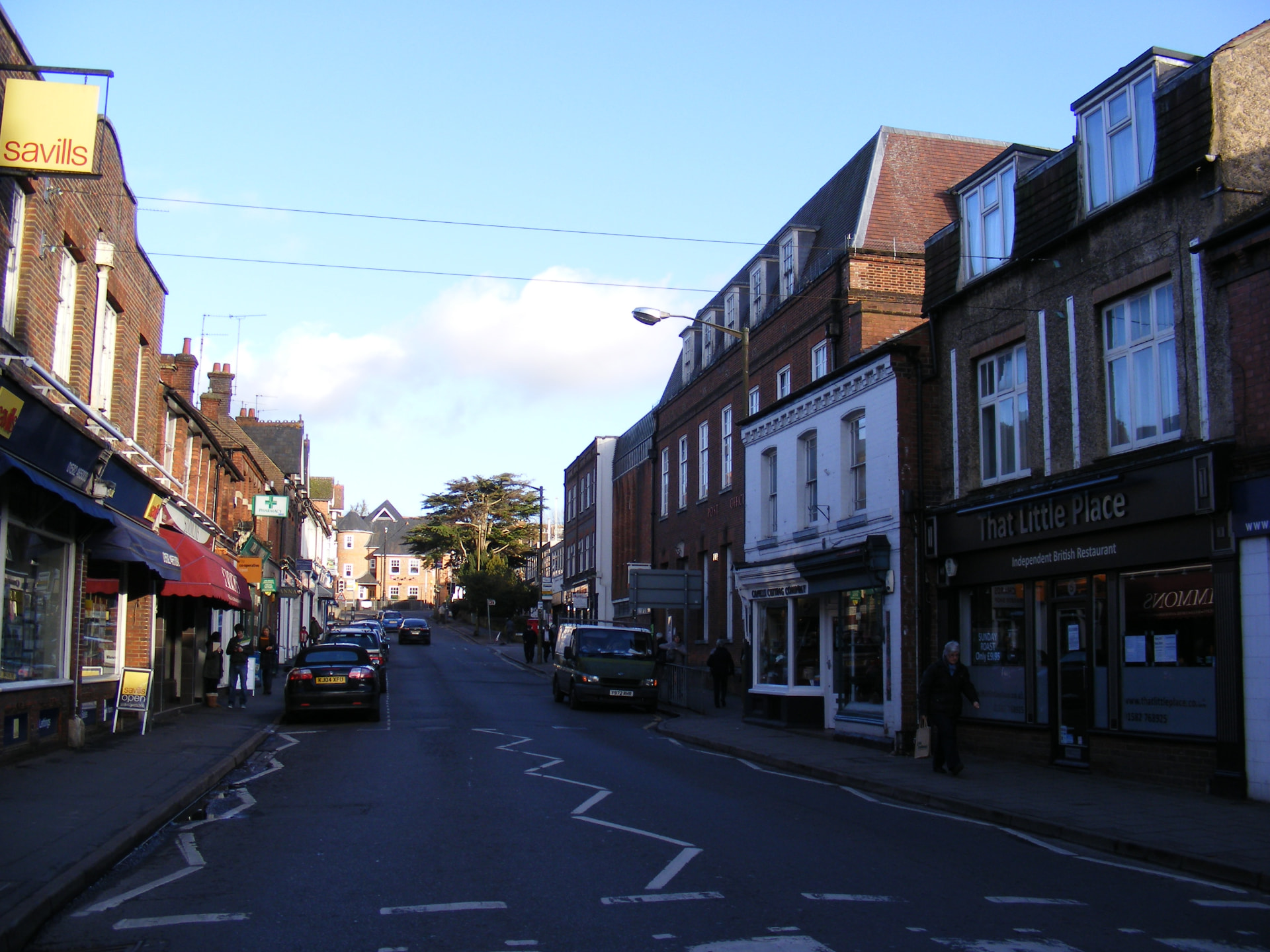 Independent shops and pedestrians along Harpenden high street